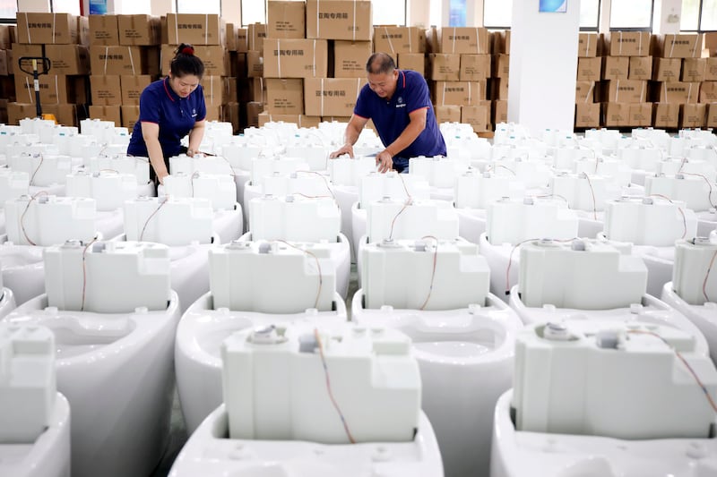 Smart toilets being assembled at a factory in Hangzhou, east China. Photograph: Xu Junyong//VCG/Getty Images