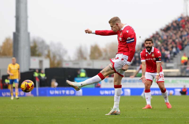 Wrexham's James McClean shoots at goal against Mansfield. His gesture makes people remember another history, one they probably don’t wish to remember. Photograph: Gary Oakley/PA Wire

