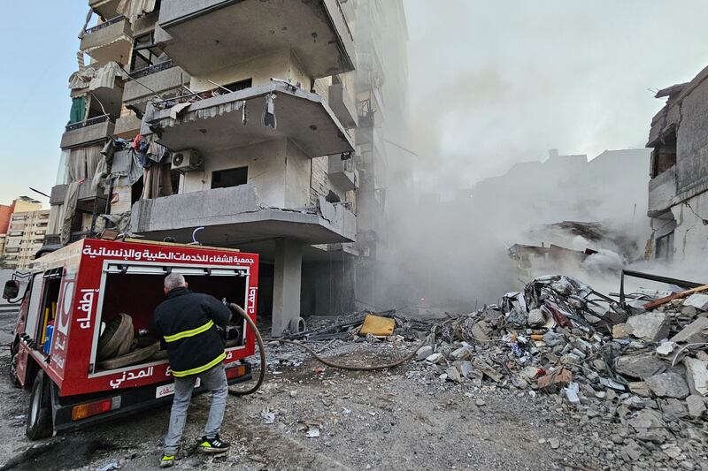 A firefighter battles a blaze at the site of an Israeli air strike that targeted the Shiyah neighborhood in Beirut's southern suburbs. Photograph: AFP via Getty Images