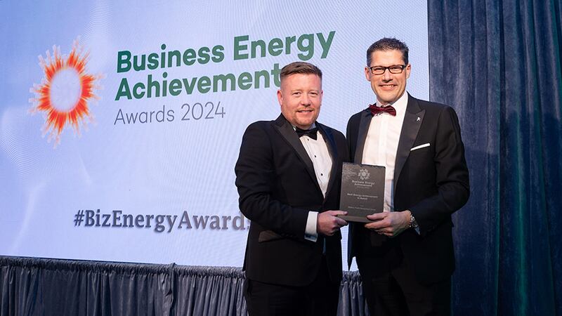 Emmet Lagan, awards judge, presents the best energy achievement in retail award to Adam Isherwood, Mahon Point shopping centre