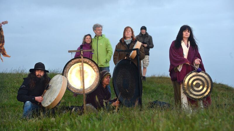 Brian Cunning, Lisa Dunne, Caroline Jeffrey and Lorna Evers at the summer solstice celebrations on the Hill of Tara, Co Meath. Photograph: Dara Mac Dónaill/The Irish Times.