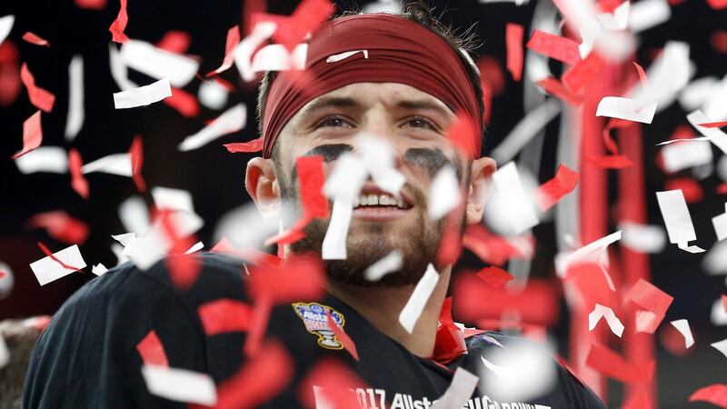 Baker Mayfield celebrates after defeating the Auburn Tigers. Photograph: Jonathan Bachman/Getty Images