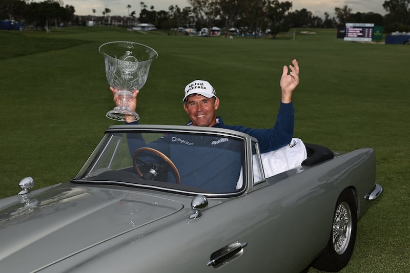 Pádraig Harrington of Ireland poses for a photo with the winners trophy in a miniature Aston Martin during the final round of the Hoag Classic. Photograph: Michael Owens/Getty