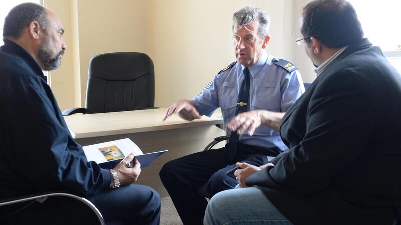 Now retired Garda inspector Dave McInerney with members of the Libyan community in Dublin in 2021. Photograph: Dara Mac Dónaill