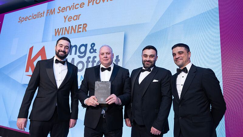 Darren Rennie, managing director, Ireland at CBRE, presents the Specialist FM Service Provider of the Year award to the King & Moffatt Connected team.