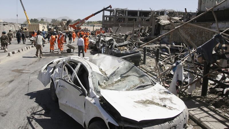 Afghan security officials inspect the scene of a suicide bomb attack nearby the German embassy in Kabul, Afghanistan. Photograph: EPA/Jawad Jalali