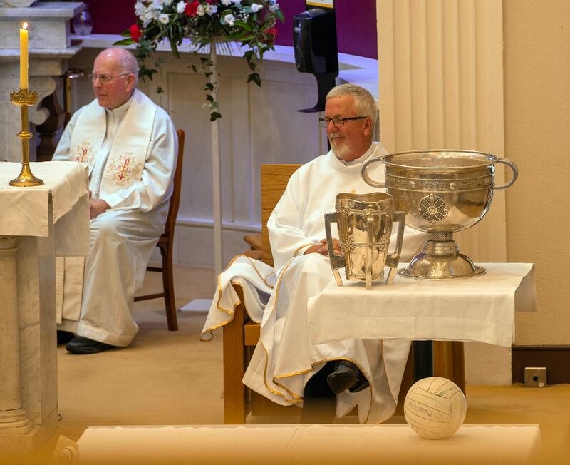 The Liam MacCarthy Cup and Sam Maguire on the altar at the funeral of Teddy McCarthy on Saturday. Photograph: Michael Mac Sweeney/Provision