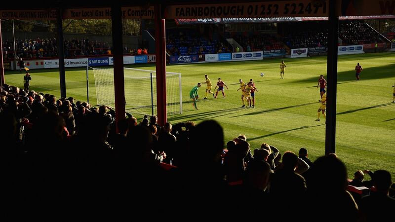 Aldershot fans watch from the stands during the FA Cup match against  Torquay United in 2014. Photograph:  Christopher Lee/Getty Images