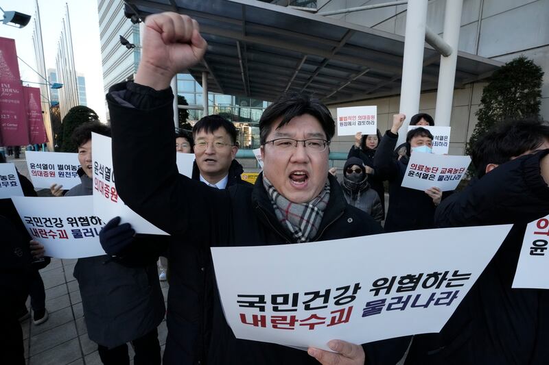 Members of the Emergency Committee of Medical School Professors Nationwide during a rally demanding the resignation of South Korean President Yoon Suk Yeol. Photograph: Ahn Young-Joon/AP