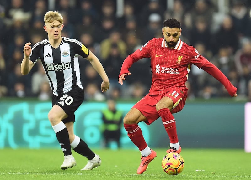 Liverpool's Mohamed Salah (R) in action against Newcastle United's Lewis Hall (L). Photograph: Peter Powell/EPA