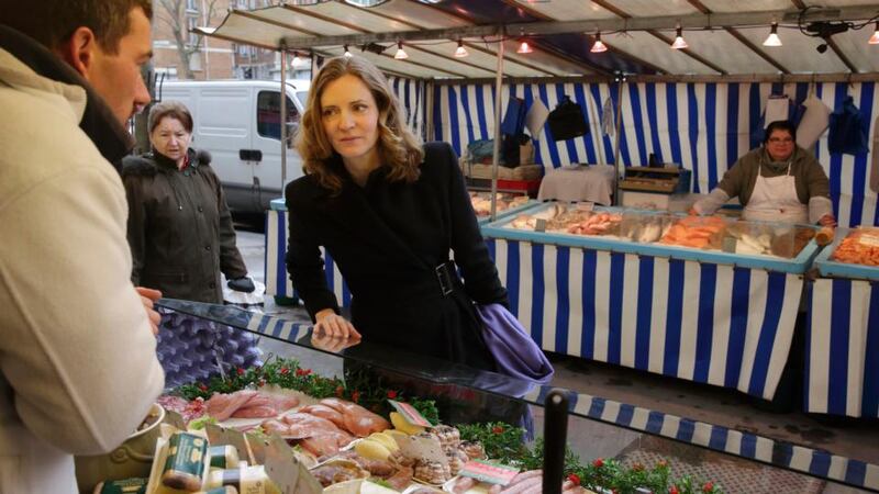 First lady: Nathalie Kosciusko-Morizet, conservative UMP party candidate in  the forthcoming Paris mayoral election, speaking to a butcher at a street market while campaigning in the city.  Photograph: Philippe Wojazer/Reuters