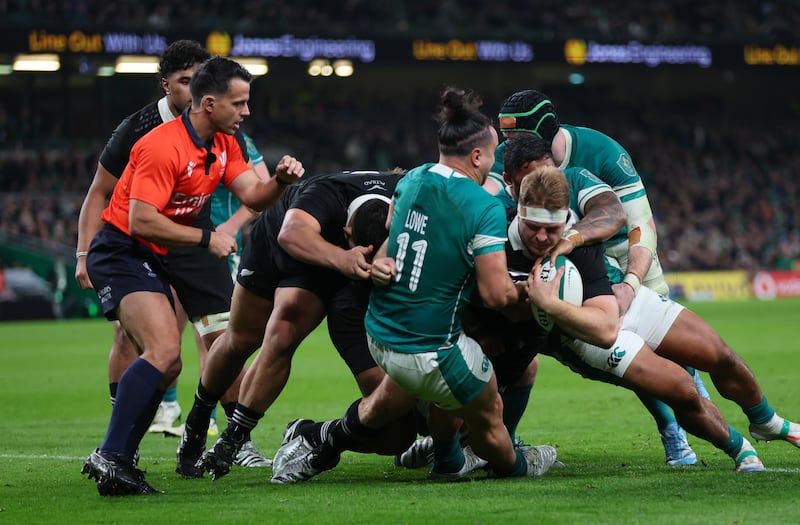 Ireland’s James Lowe and Bundee Aki tackle Sam Cane. New Zealand were impressive in the rucks as Ireland struggled to adapt. Photograph: Billy Stickland/Inpho 