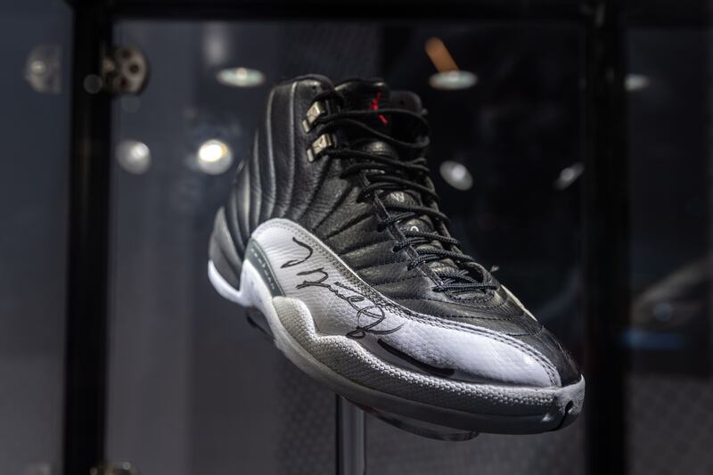 An Air Jordan XII (1997), part of the 'Dynasty Collection', the complete set of basketball super star Michael Jordan's 'Air Jordan' Six Championship Sneakers, is displayed during Sotheby's Spring Sales auction preview in Hong Kong. Photograph: Jerome Favre/EPA