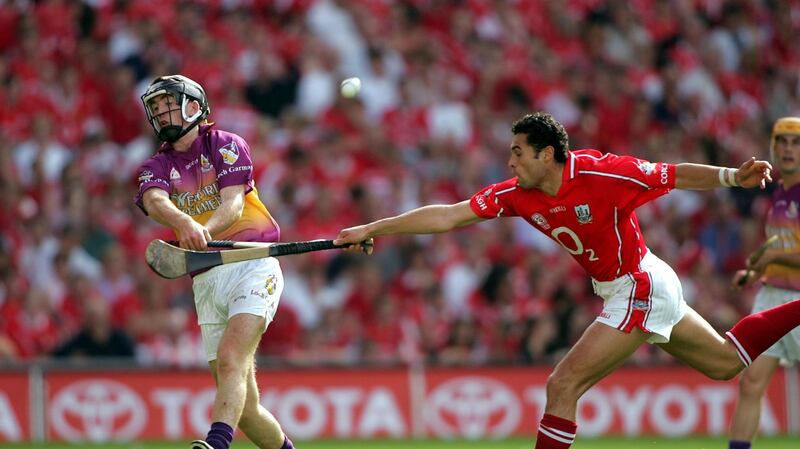 Diarmuid Lyng in action for Wexford against Cork’s Seán Óg Ó hAilpín during the 2004 All-Ireland hurling semi-final at Croke park. Photograph: Tom Honan/Inpho