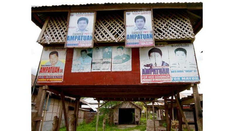 Election posters for the notorious Ampatuan family members in the Philippine provincial capital of Shariff Aguak; above right: Aquiles Zonio standing beside the grave where killers dumped the bodies of 57 people after they had been shot and hacked to death late last November on their way to an election office. Zonio escaped after being tipped off that he was among the targets. Photographs: David McNeill