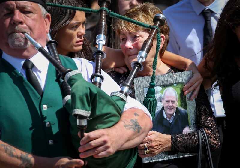 John Hutch’s widow Vera and daughters leave the church after his funeral today. Photograph: Crispin Rodwell/The Irish Times