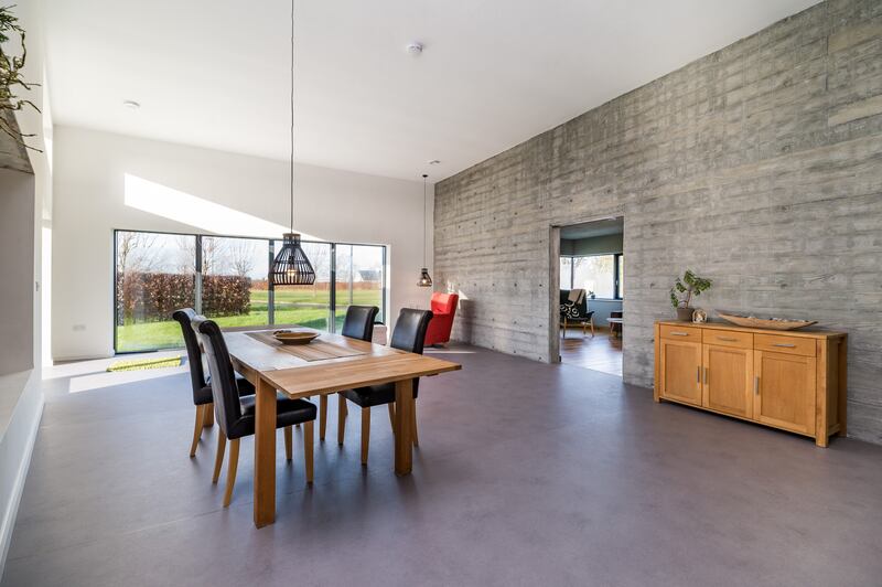 Dining room with concrete wall detail