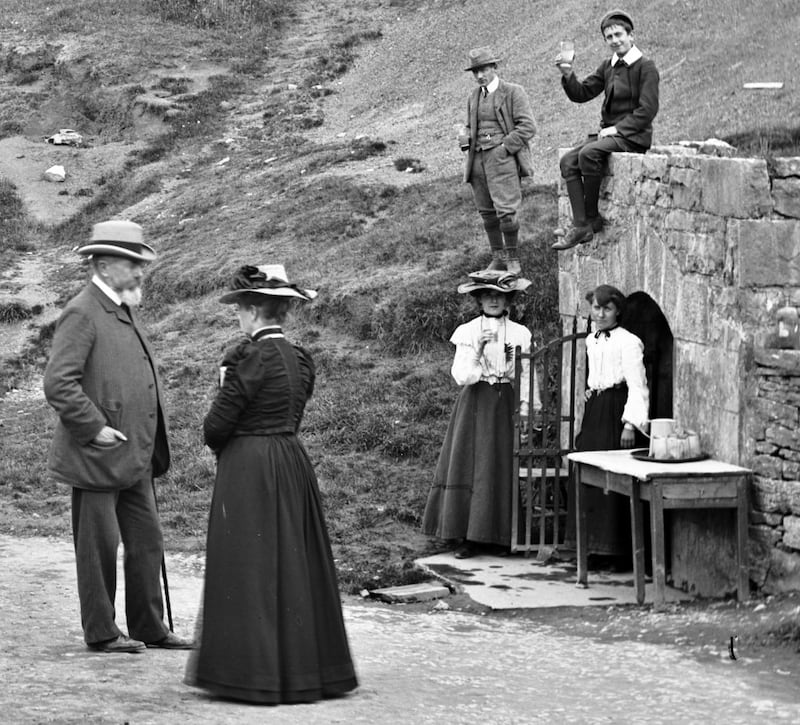 Local woman known as Biddy the Sulphur dispensing mineral waters from the twin wells in the late 19th century. Photograph: Lisdoonvarna Historical Society