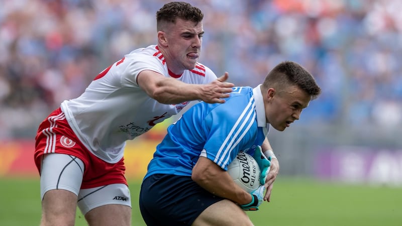 Dublin’s Eoin Murchan holds off Tyrone’s Connor McAliskey. Photograph: Morgan Treacy/Inpho