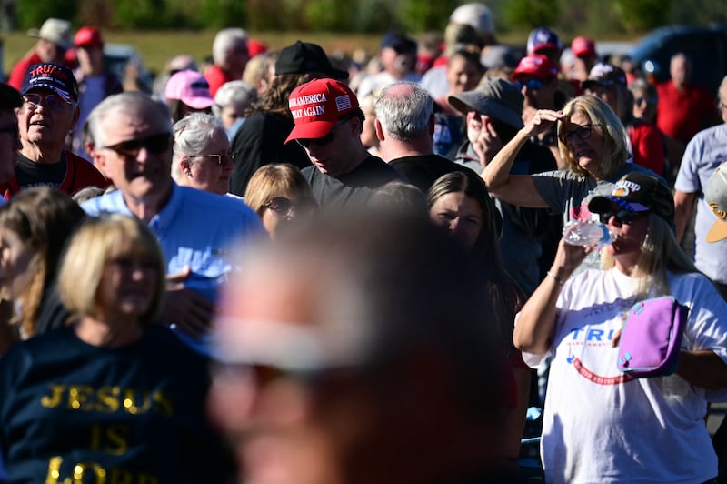 After event staff says Christ Chapel is full, people find a spot from where they can watch Donald Trump on a jumbo outdoor screen. Photograph: Jim Watson/AFP via Getty Images