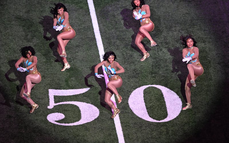 Dancers perform before the start of the Super Bowl game. Photograph: Chandan Khanna/AFP