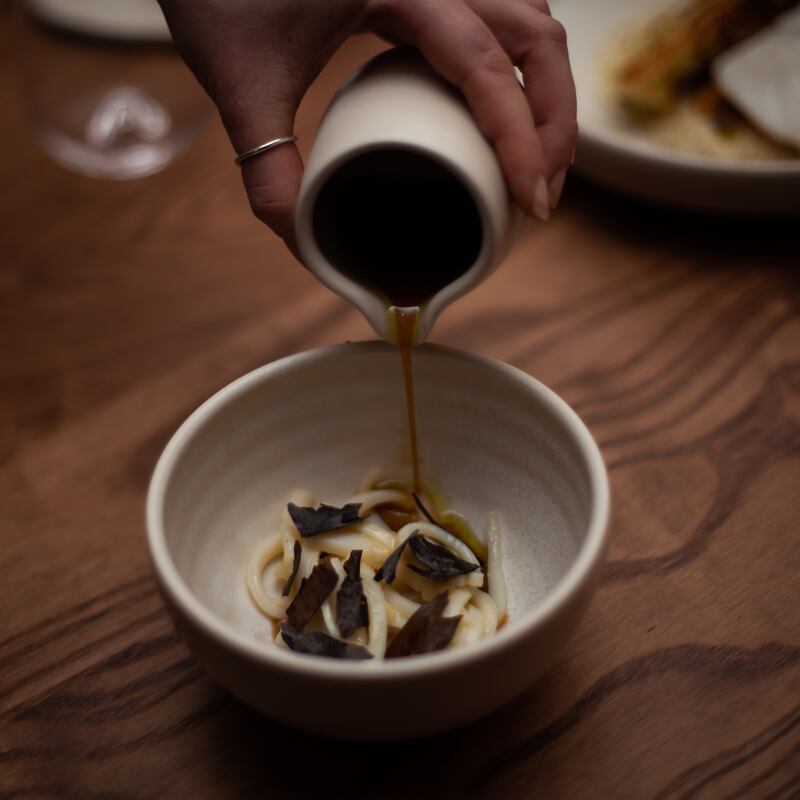 Neighbourhood: squid noodles with pickled kohlrabi and toasted kelp in a smoked-bacon dashi