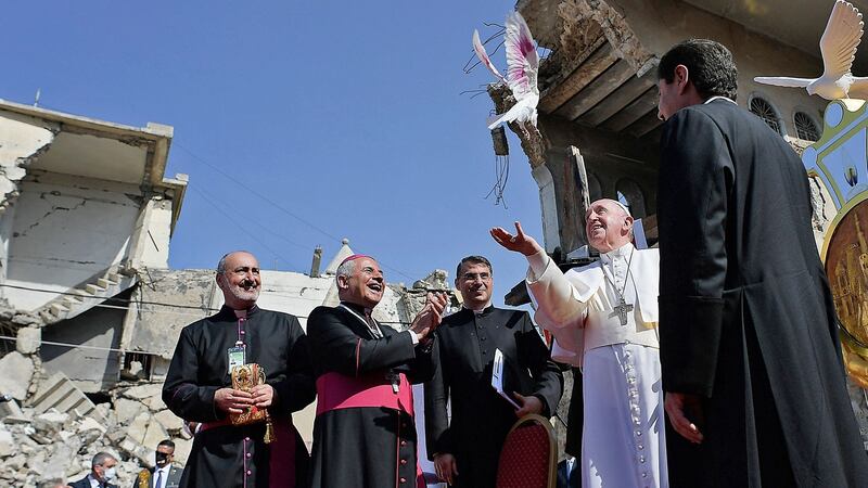 Pope Francis releases a white dove at a square near the ruins of the Syriac Catholic Church of the Immaculate Conception (al-Tahira-l-Kubra), in the old city of Iraq’s northern Mosul. Photograph: VATICAN MEDIA/AFP via Getty Images