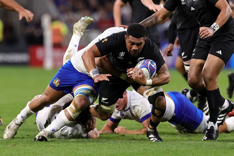 Ardie Savea of New Zealand is tackled by Marco Riccioni of Italy. Photograph: David Rogers/Getty