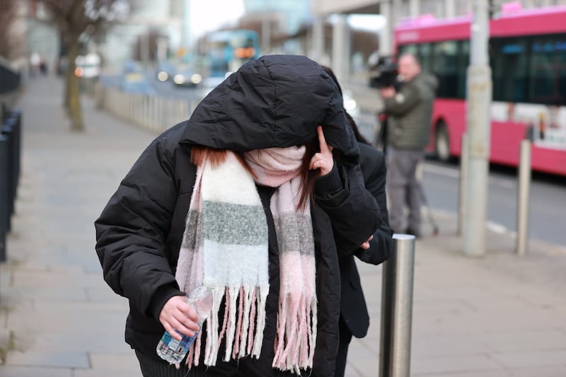 Laura Graham covered her face as she entered court. Photograph: Liam McBurney/PA Wire