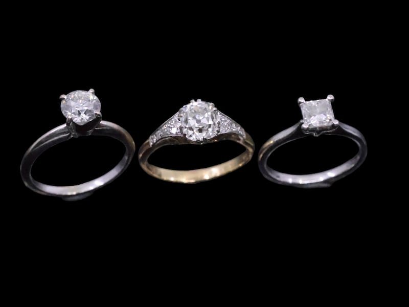 A diamond solitaire ring set in 14ct gold (€800-€1,200), a diamond solitaire ring set in 18ct gold with diamond shoulders (€2,500-€4,500) and a a diamond solitaire right set in platinum (€600-€900) at John Weldon auction