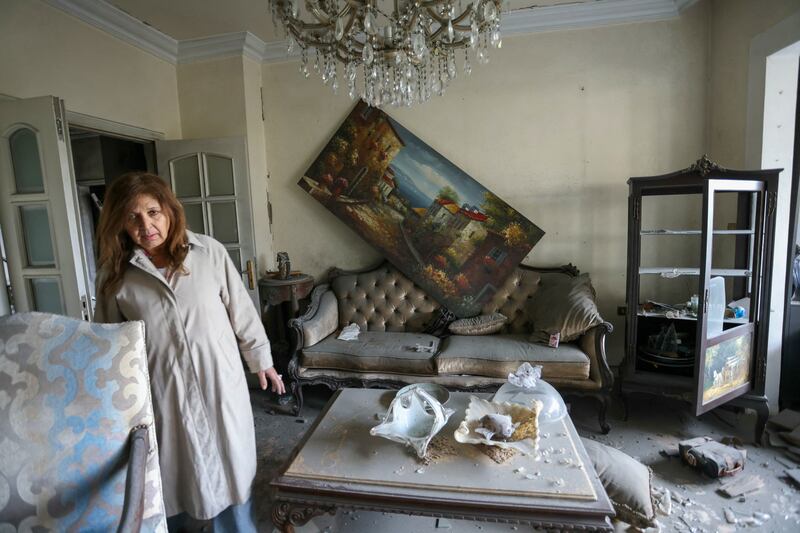 A woman stands in her damaged livingroom at the site of an Israeli air strike that targeted the area of Tayouneh on the outskirts of Beirut's southern suburbs. Photograph: Ibrahim Amro/AFP/Getty Images