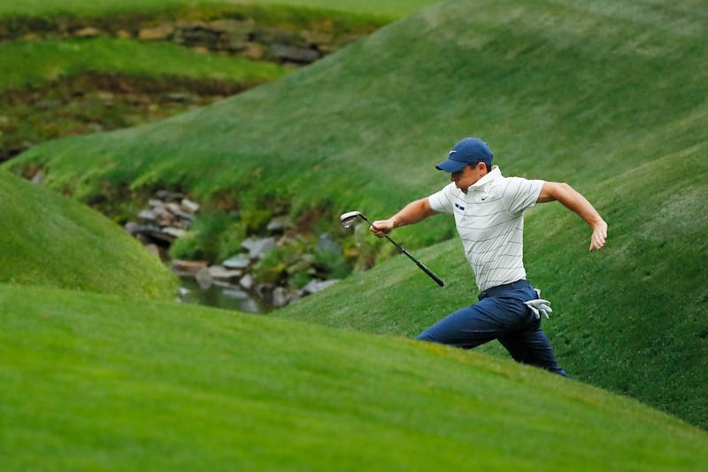 Rory McIlroy jumping across Rae's Creek on the 13th hole during the second round of the Masters in 2019. Photograph: Kevin C. Cox/Getty Images