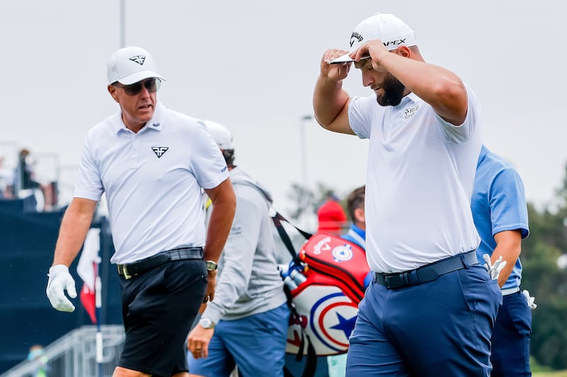 Phil Mickelson and Jon Rahm walk off the 10th tee during a practice round  on Wednesday. Photograph: Erik S Lesser/EPA