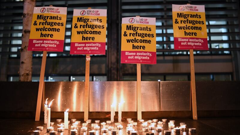 A candlelight vigil for the victims that died in a lorry container, is seen in London. Photograph: EPA