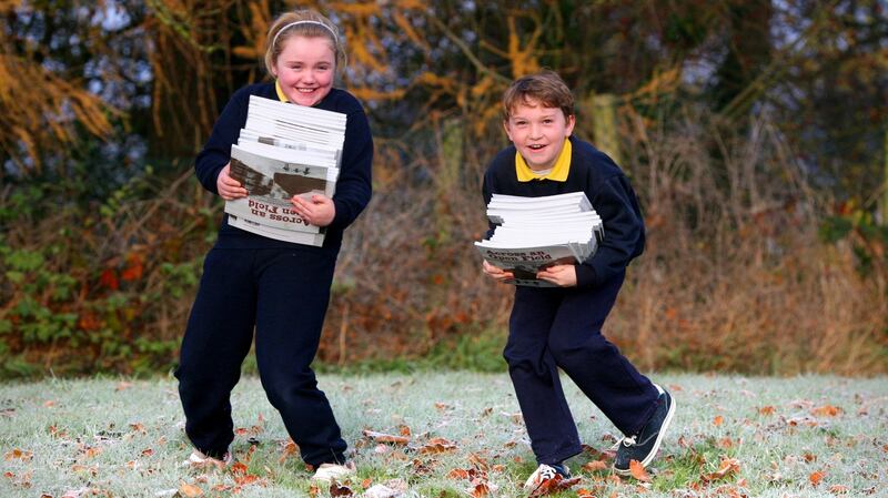 Aimee Dunne and Killian Lacey, pupils from Lisnafunchin National School, Castlecomer, Co Kilkenny, carry copies of Across and Open Field to the Kilkenny Education Centre. Photograph: Brian Farrell