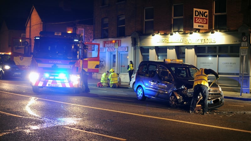 Dublin Fire Brigade attend the scene of road accident on North King Street, Dublin 7 and admininster first aid to the driver. Photograph: Aidan Crawley/The Irish Times