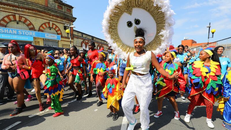 Performers at the Notting Hill Carnival in London, where people have been advised to stay hydrated amid temperatures of more than 30 degrees. Photograph: EPA