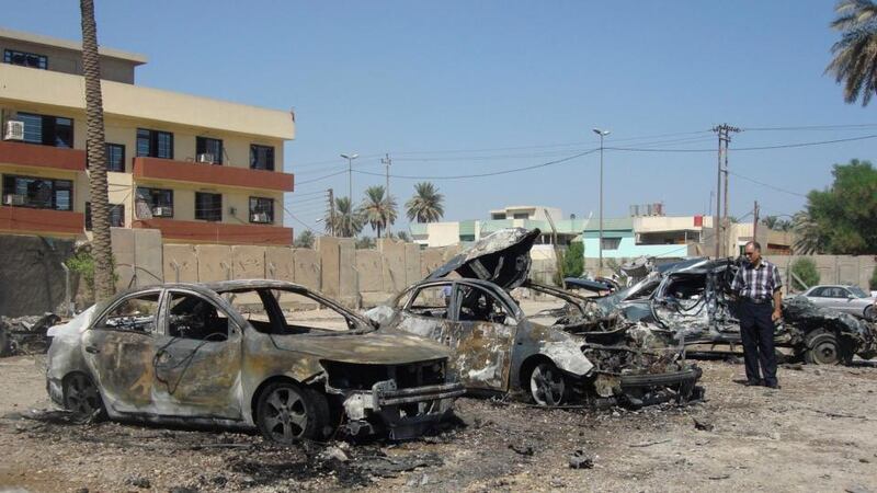 Damaged vehicles at the site of a car bomb attack in Baghdad’s Kadhimiya district earlier today. Photograph: Hadeer Abbas/Reuters