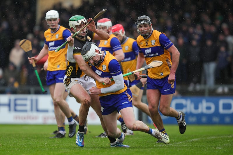 Ian McNamara of Clare is tackled by Paddy Degan of Kilkenny. Photograph: Natasha Barton/Inpho