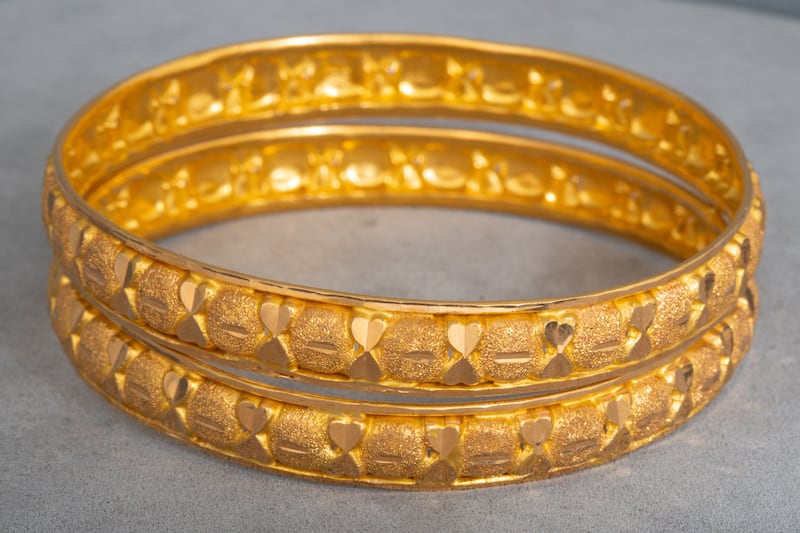 Eastern-style set of two 21ct gold bangles