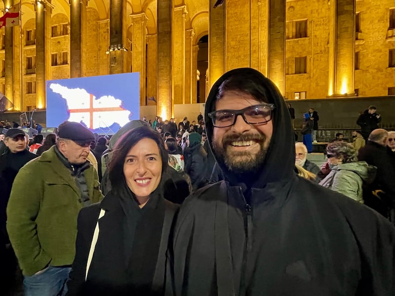 Tbilisi residents Sofia Japaridze and Roland Kalandadze outside Georgia's parliament on Monday night. Photograph: Daniel McLaughlin