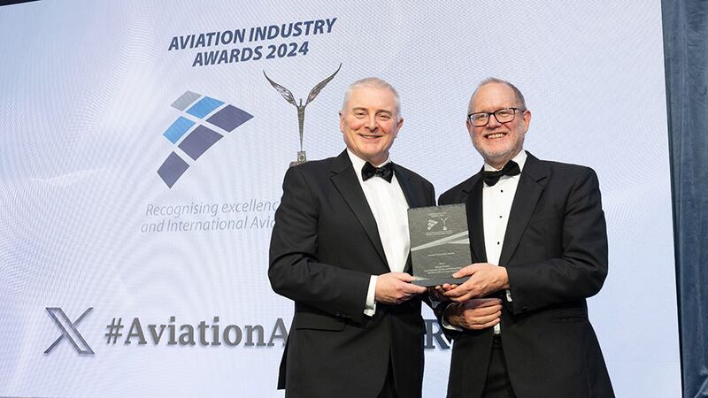 David Usher, awards judge, presents the aviation innovation award to David Miller, Inflight Dublin