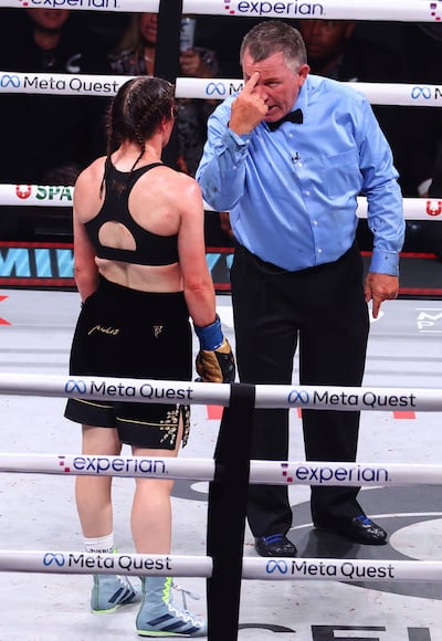 Katie Taylor has a point deducted by referee Jon Schorle after a head clash during her fight with Amanda Serrano. Photograph: Ed Mulholland/Inpho
