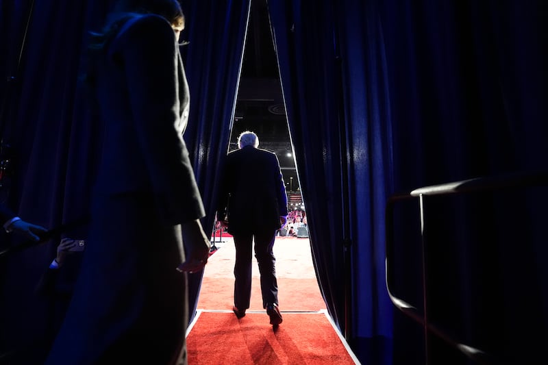 Donald Trump walks on stage with Melania Trump during an election night event at the Palm Beach County Convention Center. Photograph: Doug Mills/The New York Times
                      