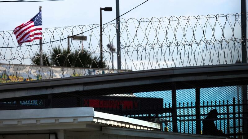 A man crosses over the Gateway international Bridge in Brownsville, Texas. Photograph: Jim Watson/AFP via Getty