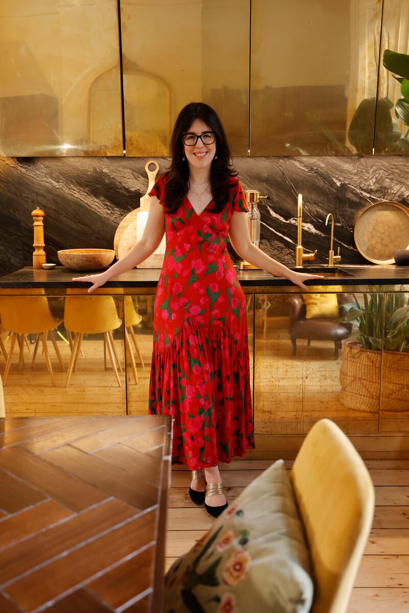 Unlacquered brass cupboards run the full length of her new kitchen. Photograph: Alan Betson 

