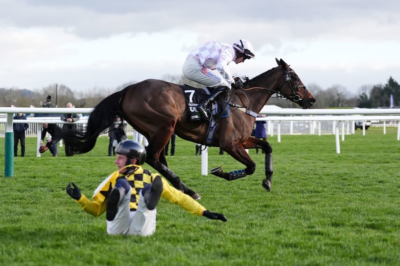 Paul Townend falls from State Man as Golden Ace ridden by Lorcan Williams goes on to win the Unibet Champion Hurdle. Photograph: Adam Davy/PA Wire