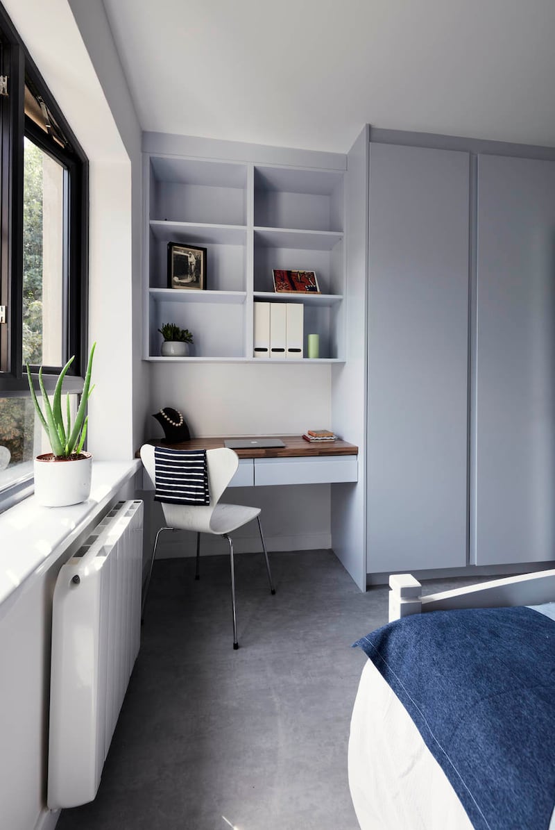 After: Bedroom with home office and open shelving. Photograph: Philip Lauterbach