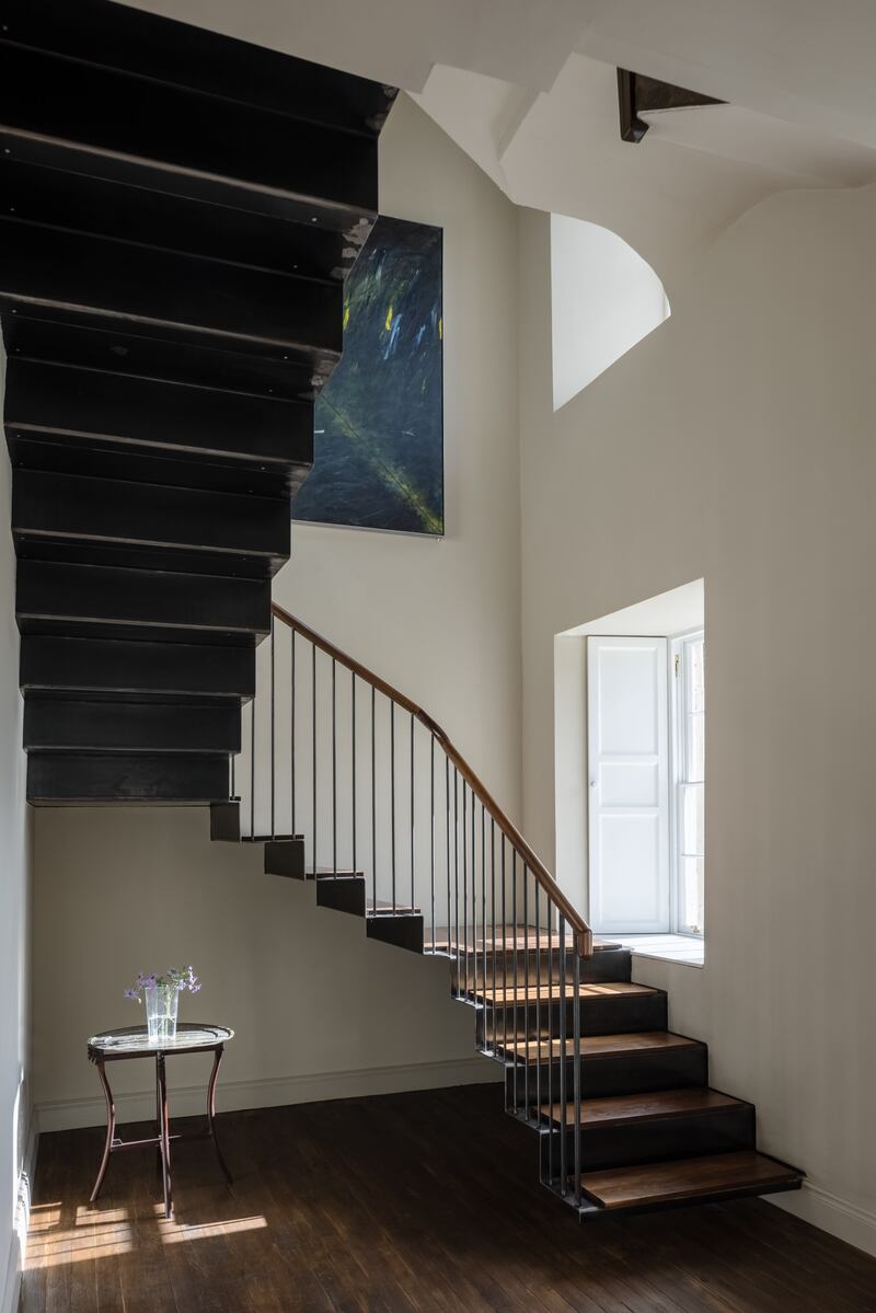 The steel staircase from the ground floor to the living area. Photograph: Ste Murray