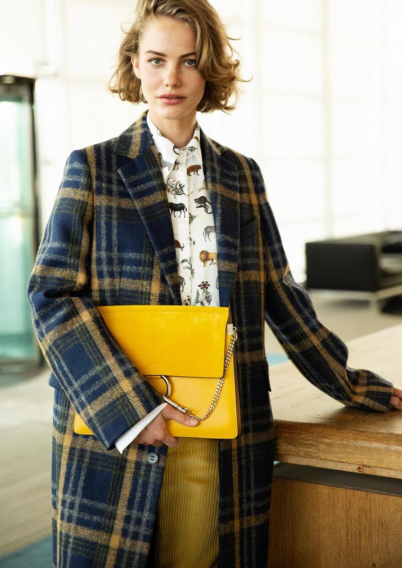 Navy check coat €950 Acne, wildlife print shirt €395 Victoria Beckham, yellow corduroy trousers €320 Isabel Marant, yellow suede bag €1,450 Chloe, all from Brown Thomas